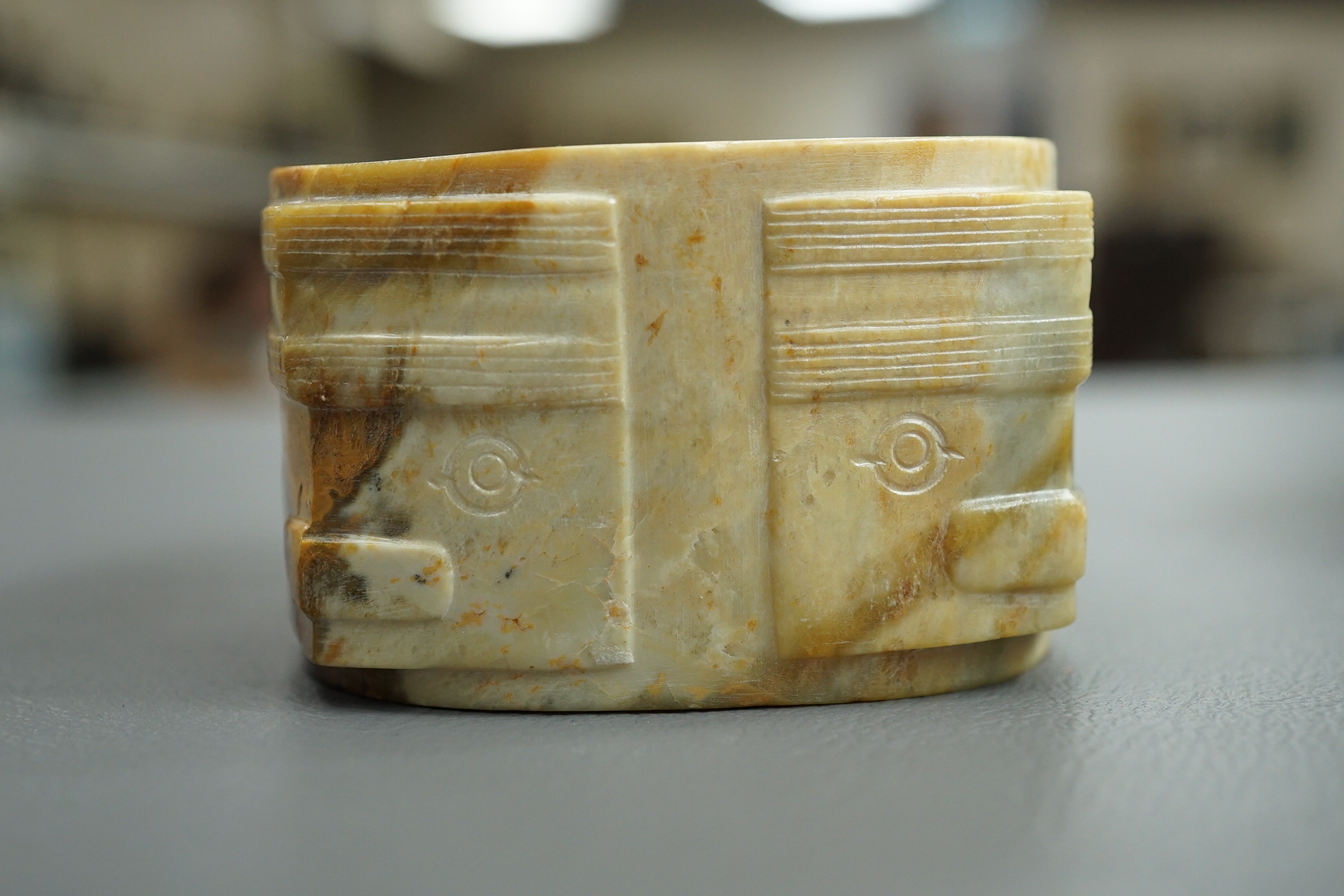 Four Chinese archaistic hardstone or burnt jade cong or cylinders